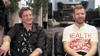 Rhys Darby & Jason Lei Howden talk 'Guns Akimbo' - Interview Video Thumbnail